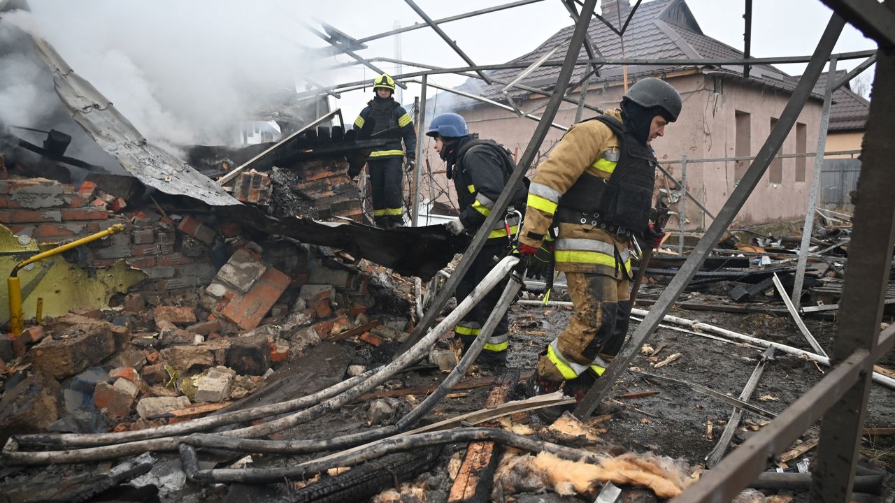 Rescuers of the State Emergency Service work to put out a fire in a private house after a drone strike in Kharkiv, on December 25, 2024, amid the Russian invasion in Ukraine. The Ukrainian president on December 25 denounced an "inhumane" attack from Russia, which launched over 170 missiles and drones on his war-torn country's power grid on Christmas Day, killing one and causing widespread blackouts. The country woke up at 5:30 am (0330 GMT) to an air raid alarm, shortly followed by air force reports that Russia had launched Kalibr cruise missiles from the Black Sea. (Photo by SERGEY BOBOK / AFP) (Photo by SERGEY BOBOK/AFP via Getty Images)