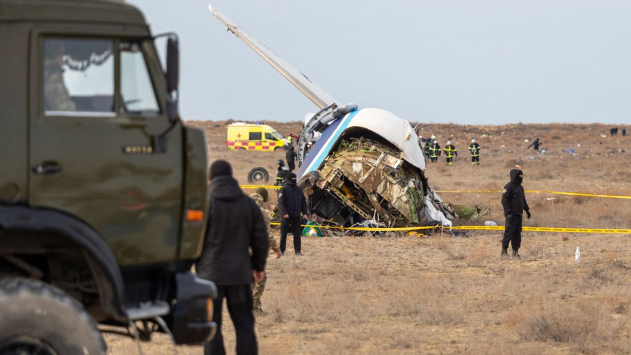 Emergency specialists work at the crash site of an Azerbaijan Airlines passenger jet near the western Kazakh city of Aktau on December 25, 2024. (Photo by Issa Tazhenbayev / AFP) (Photo by ISSA TAZHENBAYEV/AFP via Getty Images)