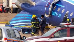 Emergency specialists work at the crash site of an Azerbaijan Airlines passenger jet near the western Kazakh city of Aktau on December 25, 2024. The Embraer 190 aircraft was supposed to fly northwest from the Azerbaijani capital Baku to the city of Grozny in Chechnya in southern Russia, but instead diverted far off course across the Caspian Sea. It crashed on December 25, 2024 near the city of Aktau in Kazakhstan. (Photo by Issa Tazhenbayev / AFP) (Photo by ISSA TAZHENBAYEV/AFP via Getty Images)