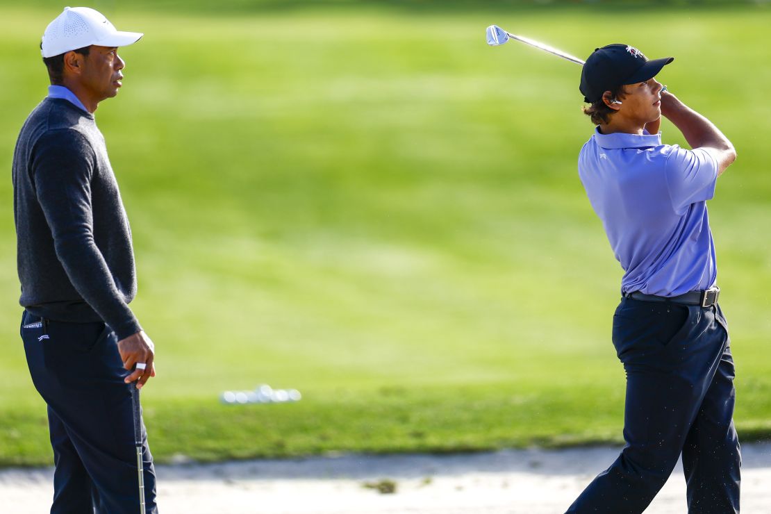 Tiger Woods and son Charlie Woods warmed up Friday ahead of the PNC Championship.