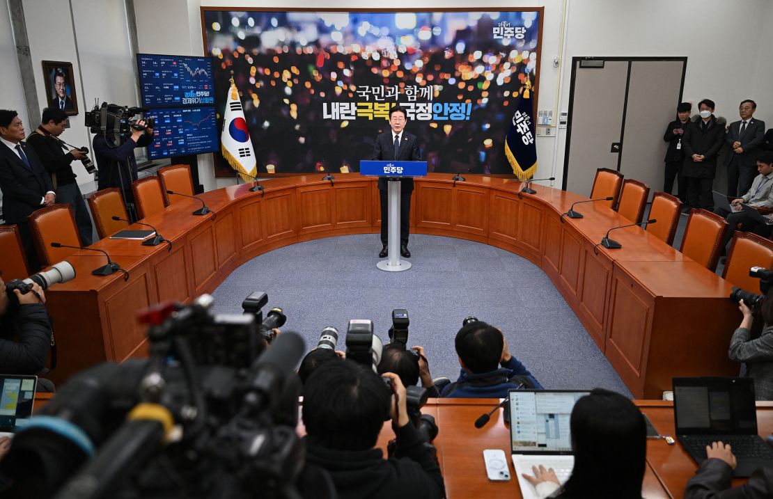 Lee Jae-myung delivers a statement on the impeachment motion against Han Duck-soo at the National Assembly on December 27.