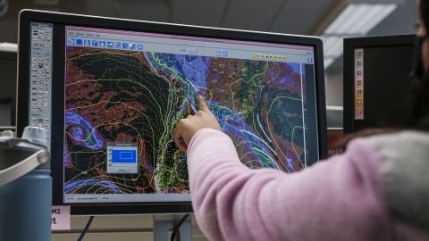 A meteorologist monitors weather activity on a computer screen at the National Oceanic and Atmospheric Administration (NOAA) Center for Weather and Climate Prediction headquarters in College Park, Maryland, US, on Thursday, Dec. 5, 2024. The conservative Project 2025 roadmap calls for slashing NOAA funding at a time when China is investing heavily in climate research. Photographer: Michael A. McCoy/Bloomberg via Getty Images