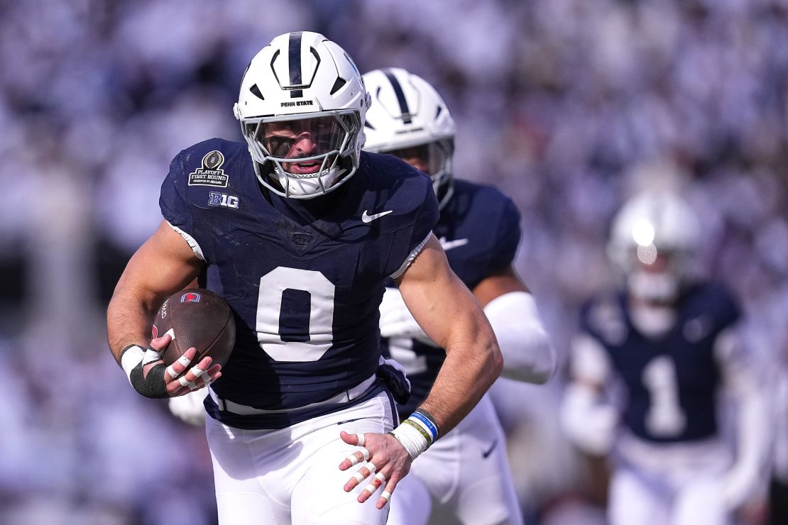 STATE COLLEGE, PENNSYLVANIA - DECEMBER 21: Dominic DeLuca #0 of the Penn State Nittany Lions intercepts a pass and returns it for a touchdown during the first quarter against the Southern Methodist Mustangs in the Playoff First Round Game at Beaver Stadium on December 21, 2024 in State College, Pennsylvania. (Photo by Mitchell Leff/Getty Images)