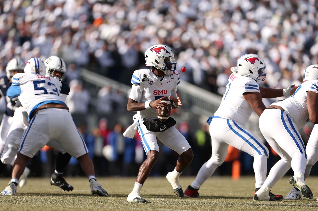 STATE COLLEGE, PENNSYLVANIA - DECEMBER 21: Kevin Jennings #7 of the Southern Methodist Mustangs looks to throw the ball during the first quarter against the Penn State Nittany Lions in the Playoff First Round Game at Beaver Stadium on December 21, 2024 in State College, Pennsylvania. (Photo by Scott Taetsch/Getty Images)