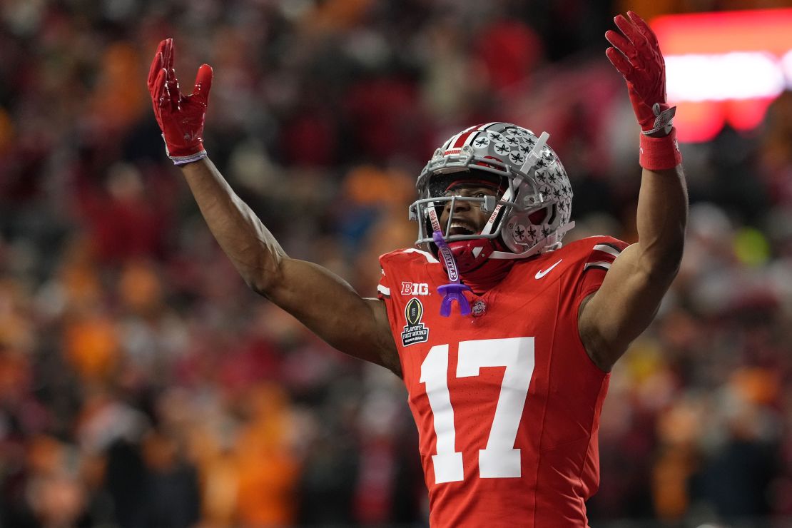 Carnell Tate of the Ohio State Buckeyes celebrates after a Buckeyes touchdown against the Tennessee Volunteers.