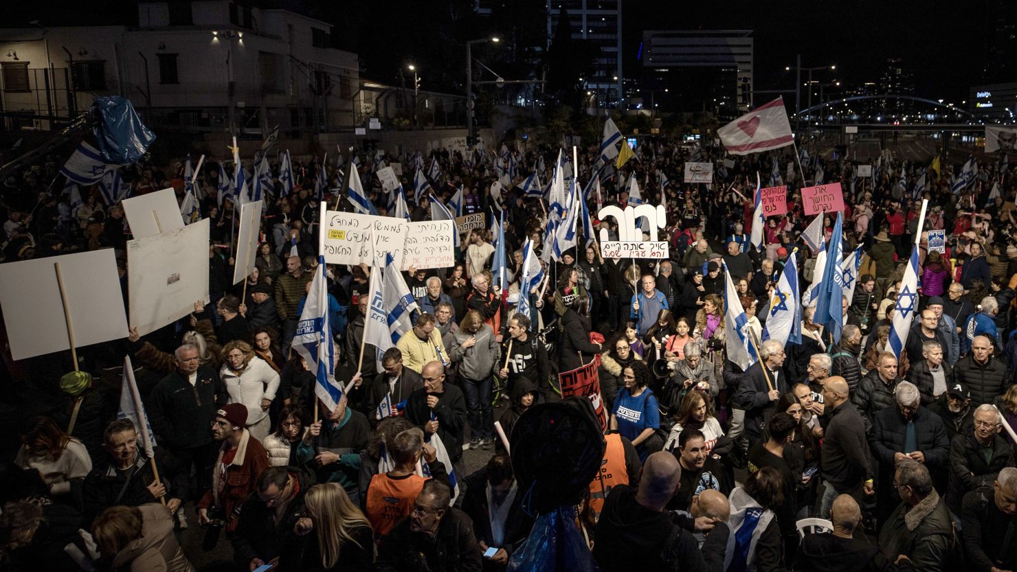 Hundreds of people gather to hold a demonstration demanding a ceasefire and a hostage swap agreement in Gaza, on December 28, 2024, in Tel Aviv, Israel.