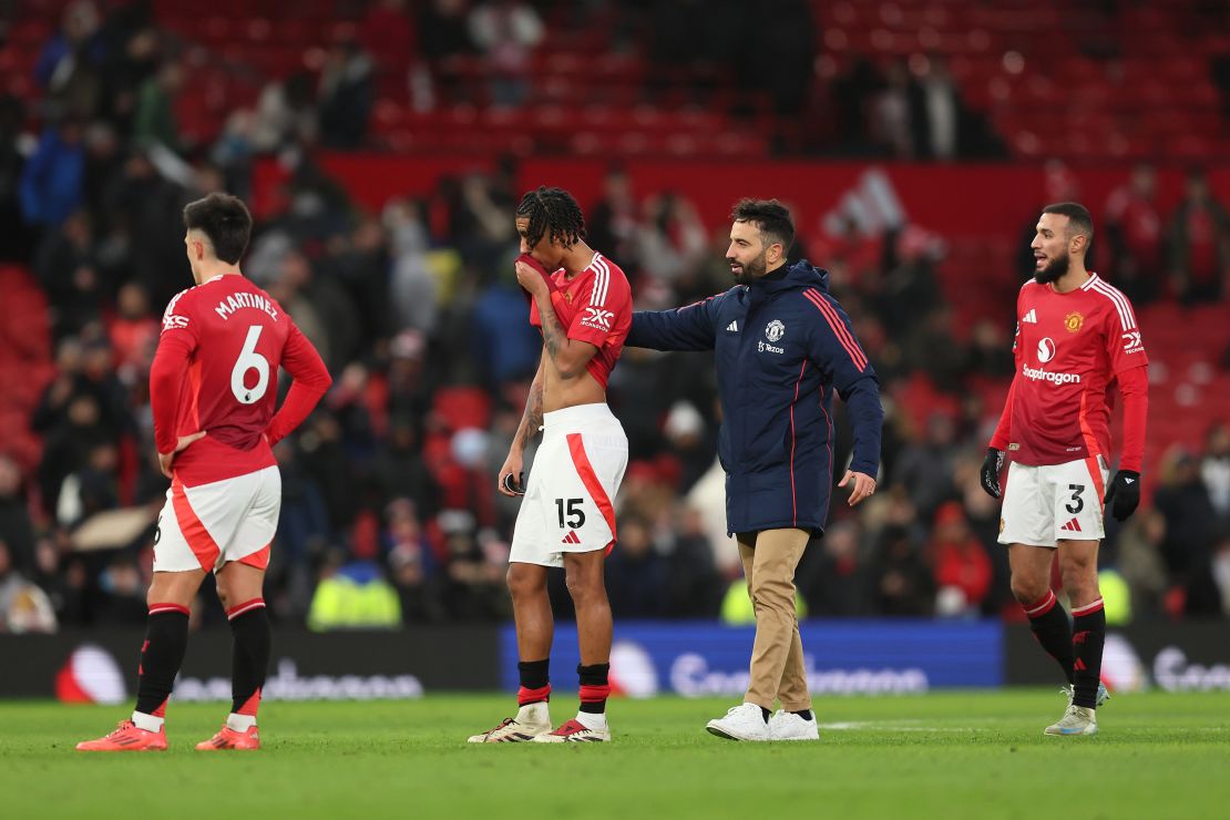 MANCHESTER, ENGLAND - DECEMBER 22: Ruben Amorim, Manager of Manchester United, interacts with Leny Yoro of Manchester United after the Premier League match between Manchester United FC and AFC Bournemouth at Old Trafford on December 22, 2024 in Manchester, England. (Photo by Matt McNulty/Getty Images)