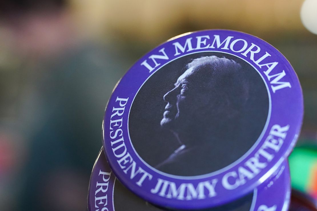 A button commemorating former President Jimmy Carter's death in his hometown of Plains, Georgia, on December 30.