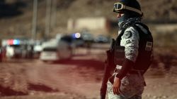 A member of the National Guard stands guard at the crime scene where a National Migration Institute (INM) agent was murdered on a hill near the Precos military checkpoint in the town of Samalayuca, municipality of Juarez, Chihuahua state, Mexico on December 30, 2024. A Mexican immigration agent was killed on Monday in Juarez, on the US border, after asking a group of migrants to identify themselves, authorities said. (Photo by HERIKA MARTINEZ / AFP) (Photo by HERIKA MARTINEZ/AFP via Getty Images)