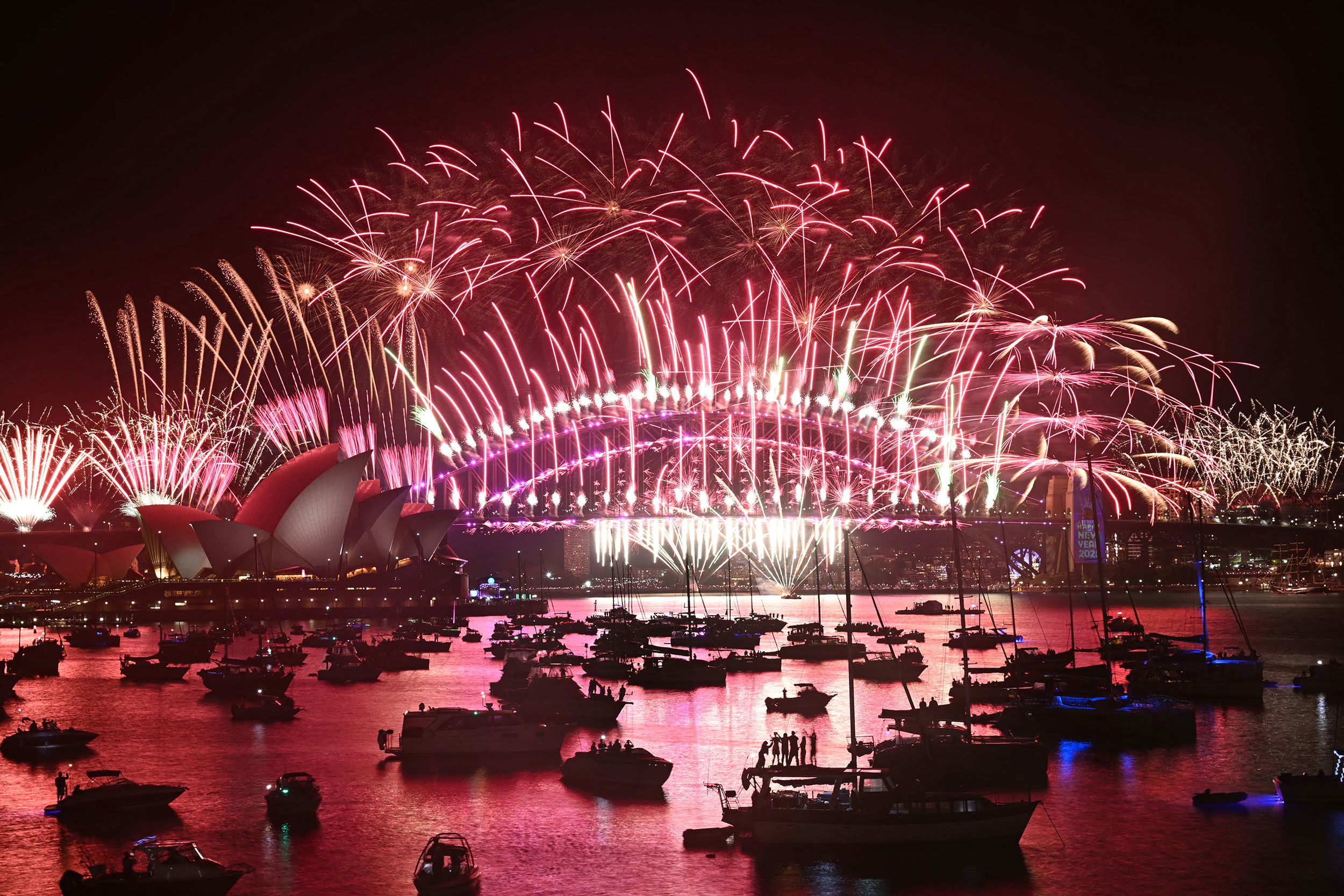 Fireworks explode over the Sydney Opera House.