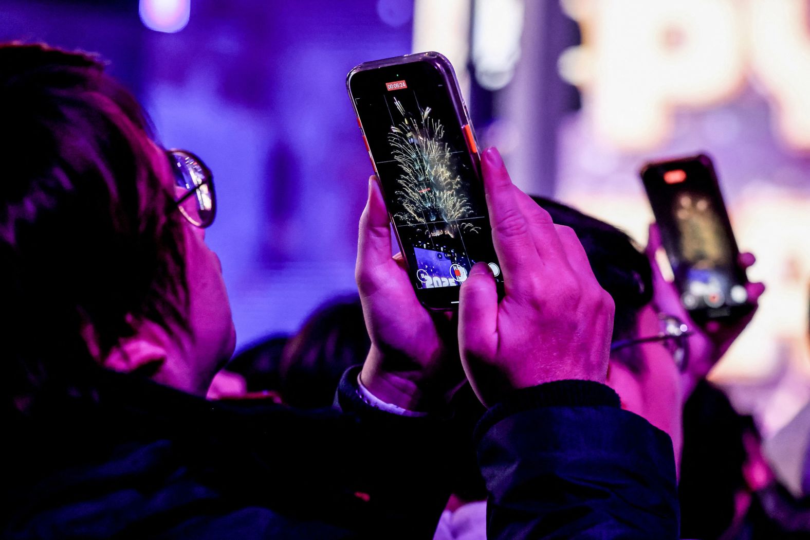 People take video of fireworks from the Taipei 101 building in Taiwan.