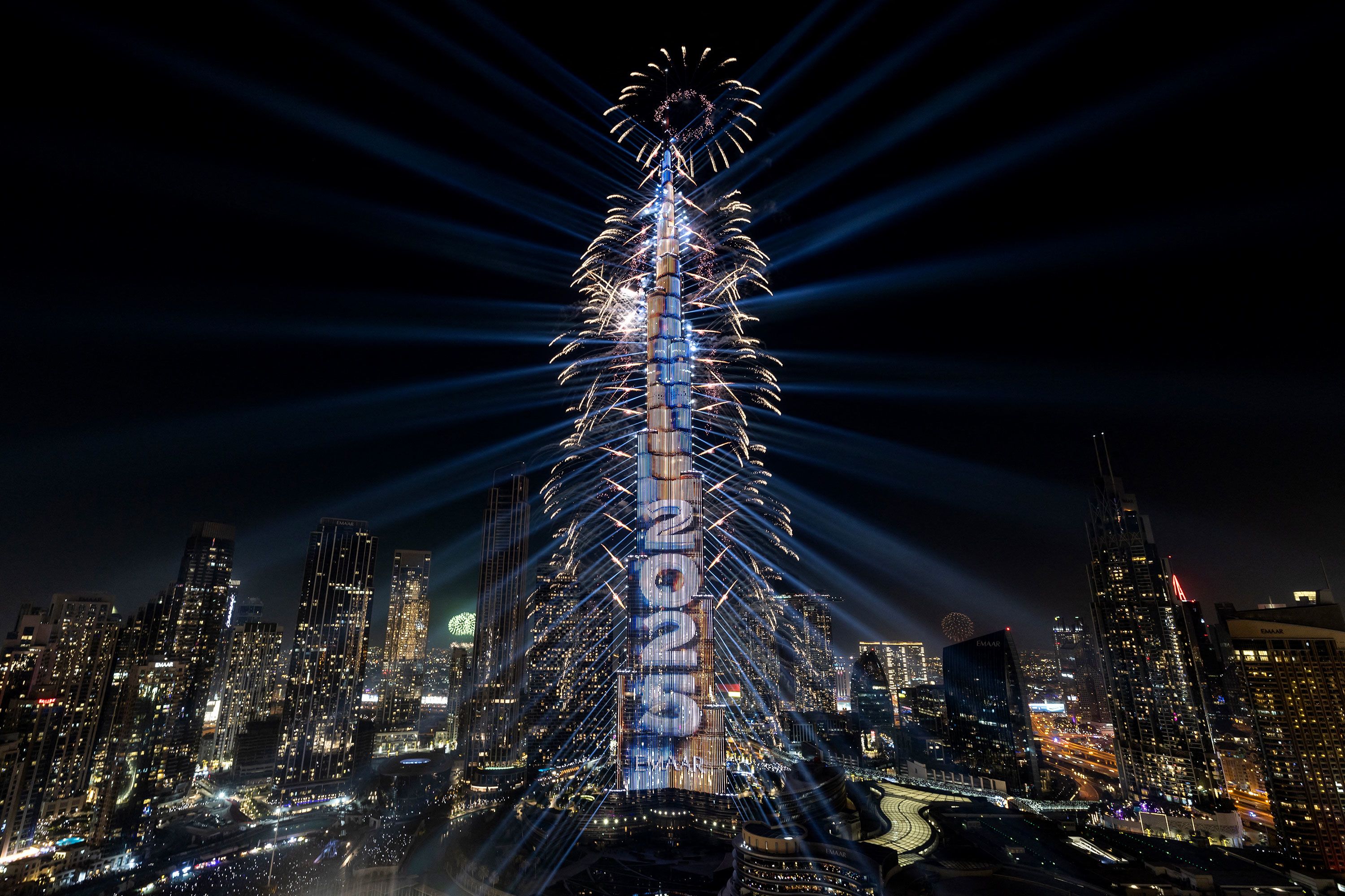 A light show and fireworks illuminate the Burj Khalifa, the world's tallest building, during New Year's celebrations in Dubai, United Arab Emirates.