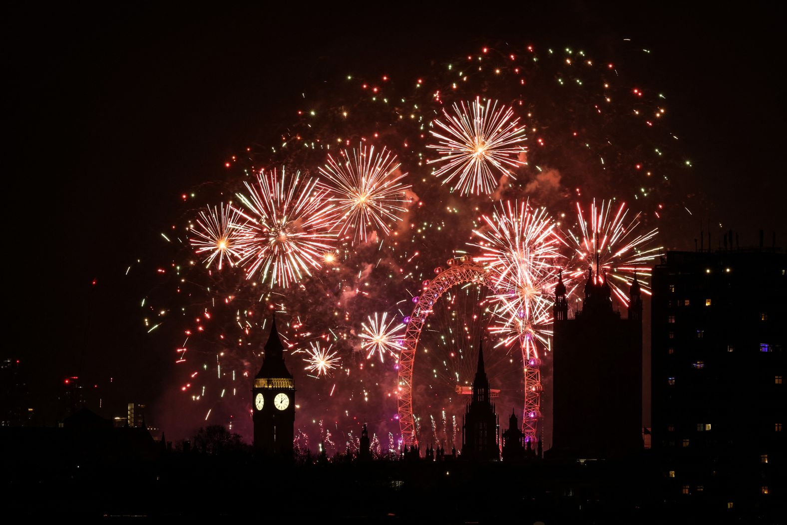 Fireworks explode in the sky in central London.