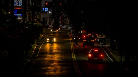 SAN JUAN, PUERTO RICO - DECEMBER 31: The headlights of cars light up a dark street in San Juan, Puerto Rico on December 31, 2024 in San Juan, Puerto Rico. The majority of the population on the island is without electricity due to a major power outage. (Photo by Miguel J. Rodriguez Carrillo/Getty Images)