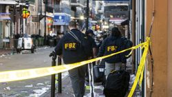 FBI investigators arrive at the scene where the white Ford F-150 pickup truck that crashed into a work lift after allegedly driving into a crowd of New Year's revelers in the French Quarter of New Orleans, Louisiana, on January 1, 2025. At least 10 people were killed and 30 injured Wednesday when a vehicle plowed overnight into a New year's crowd in the heart of the thriving New Orleans tourist district, authorities in the southern US city said. (Photo by Matthew HINTON / AFP) (Photo by MATTHEW HINTON/AFP via Getty Images)