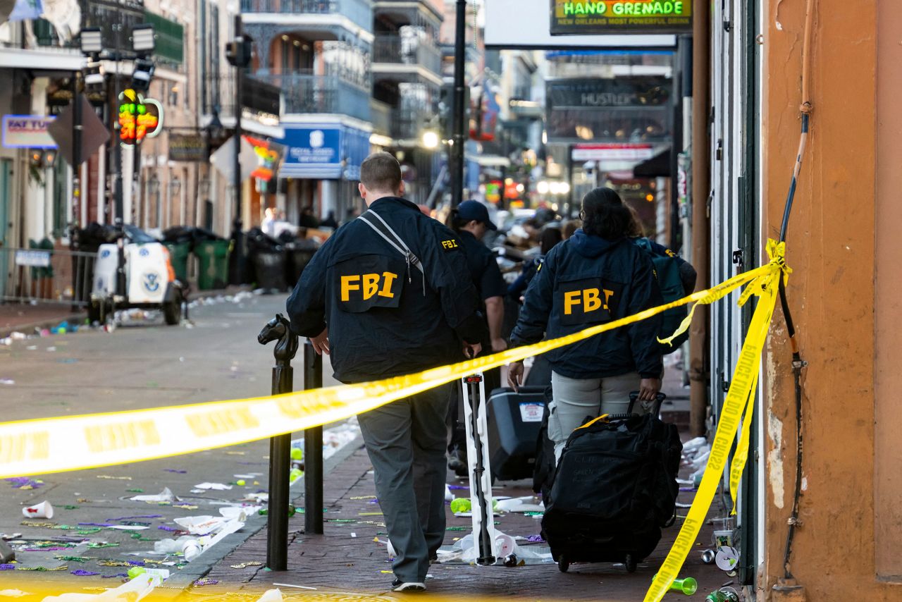 FBI investigators arrive at the scene in the French Quarter of New Orleans on January 1.