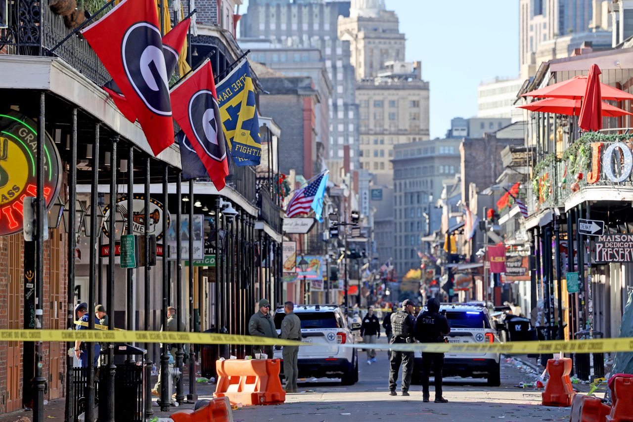 Law enforcement officers from multiple agencies work the scene on Bourbon Street on January 1 in New Orleans, Louisiana.