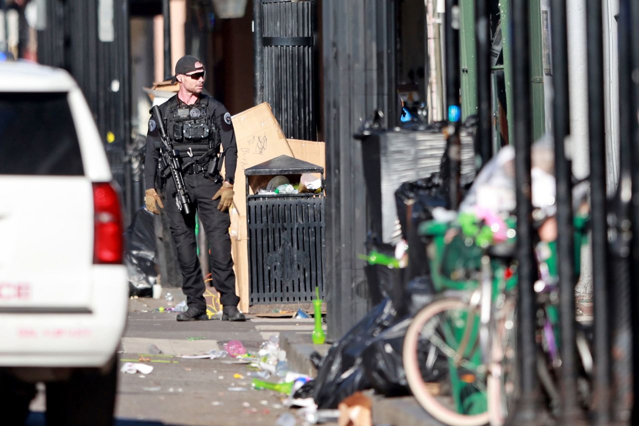 Law enforcement officers from multiple agencies work the scene on Bourbon Street in New Orleans on January 1.