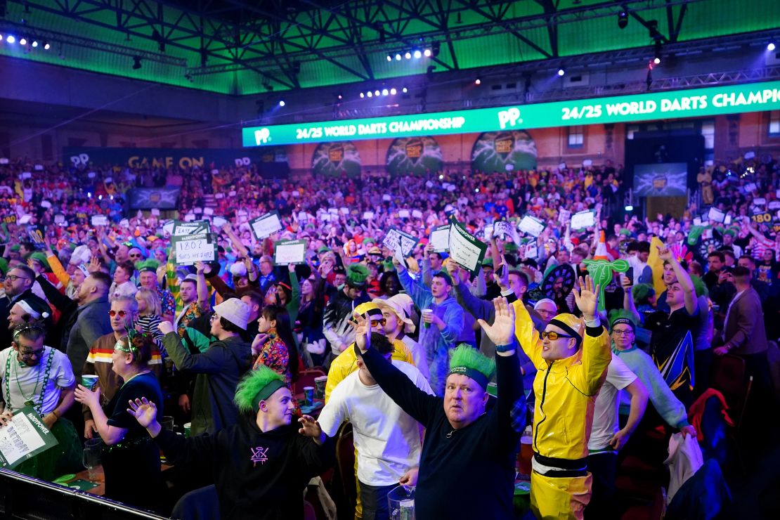 Spectators watch the quarter-final match between Peter Wright and Stephen Bunting during day fourteen of the Paddy Power World Darts Championship at Alexandra Palace, London. Picture date: Wednesday January 1, 2025. (Photo by Zac Goodwin/PA Images via Getty Images)