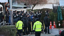 Police and anti-corruption investigators arrive at the residence of South Korea's impeached President Yoon Suk Yeol in Seoul on January 3, 2025.
