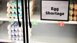 Egg shortage signage is displayed on partially empty shelves at a Sprouts Farmer's Market grocery store in Lawndale, California on January 2, 2025. Bird flu and other factors have contributed to an egg shortage in California. (Photo by Patrick T. Fallon / AFP) (Photo by PATRICK T. FALLON/AFP via Getty Images)