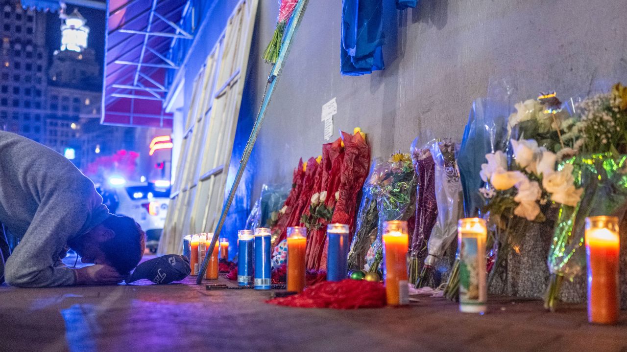 A man prays at a memorial on Bourbon Street, after it reopened to the public on January 2.