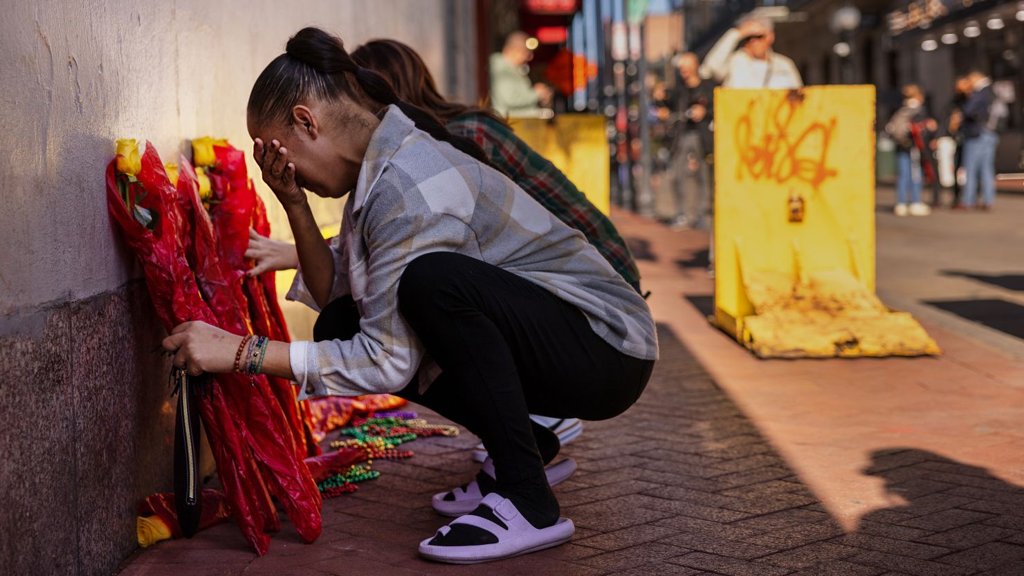 Samantha Petry weeps as Bourbon Street is reopened Thursday after a man drove a pickup into a crowd early New Year's Day in New Orleans' French Quarter.