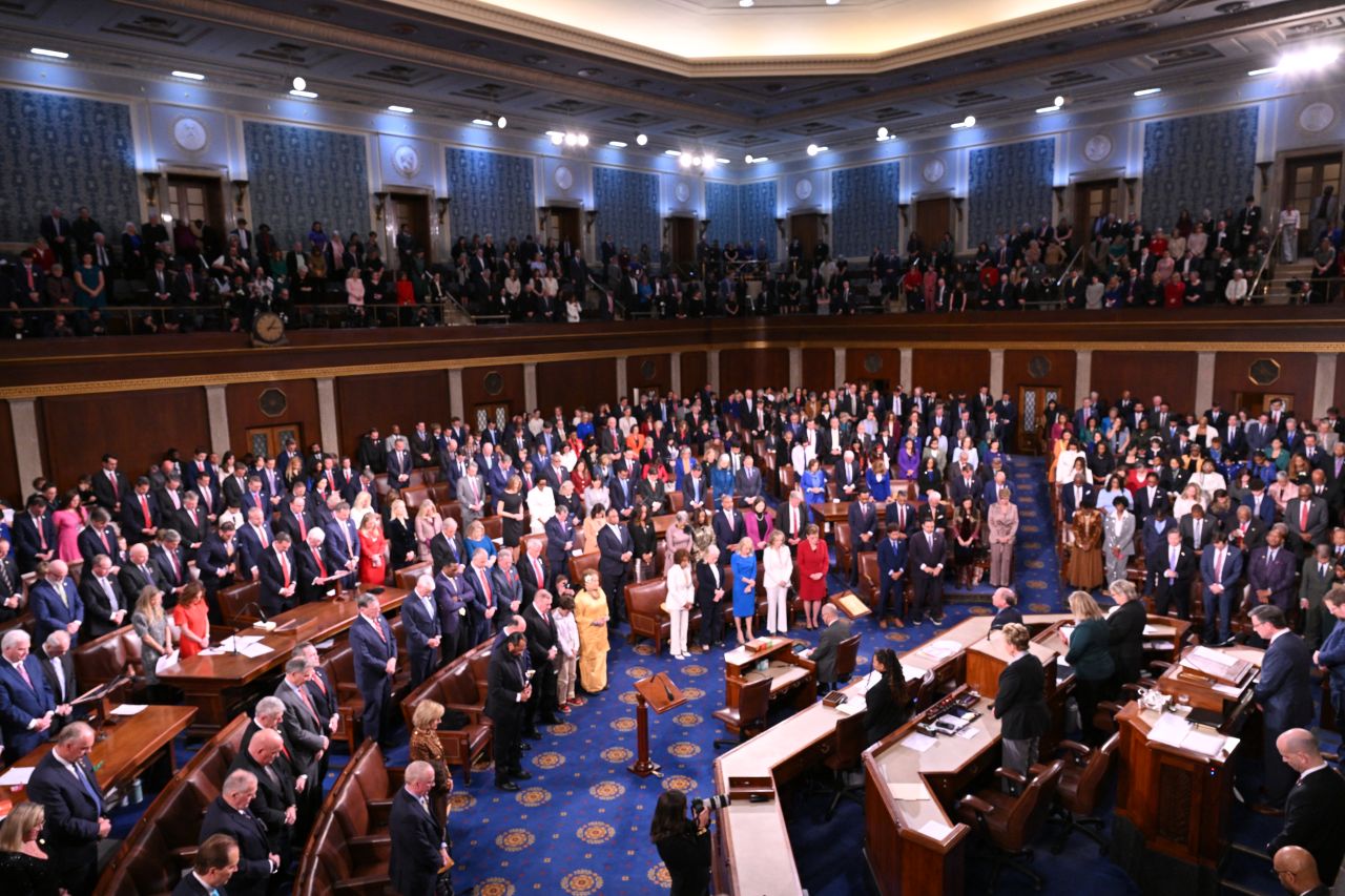 Members of the House of Representatives stand for a moment of silence to acknowlegde the victims of the terrorist attack in New Orleans during the first day of the 119th Congress in the House Chamber at the US Capitol in Washington, DC, on January 3.