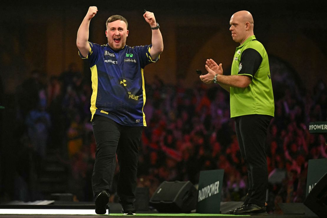 Luke Littler celebrates his win over The Netherlands' Michael van Gerwen.