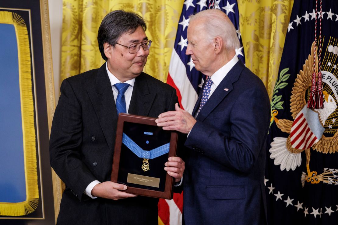 Gary Takashima accepts the Medal of Honor posthumously on behalf of his uncle, Private First Class Wataru Nakamura, from President Joe Biden.