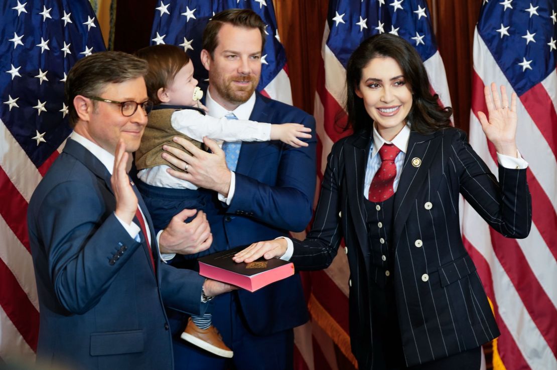 House Speaker Mike Johnson poses with Representative Anna Paulina Luna (R-Fla.) and her family during the swearing-in ceremony on the opening day of the 119th Congress at the U.S. Capitol on January 3, 2025 in Washington. left). D.C.