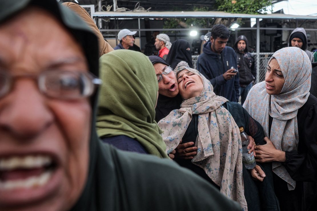 Women mourn their relatives killed by Israeli bombardment outside the Aqsa Martyrs hospital in Deir el-Balah on January 5.