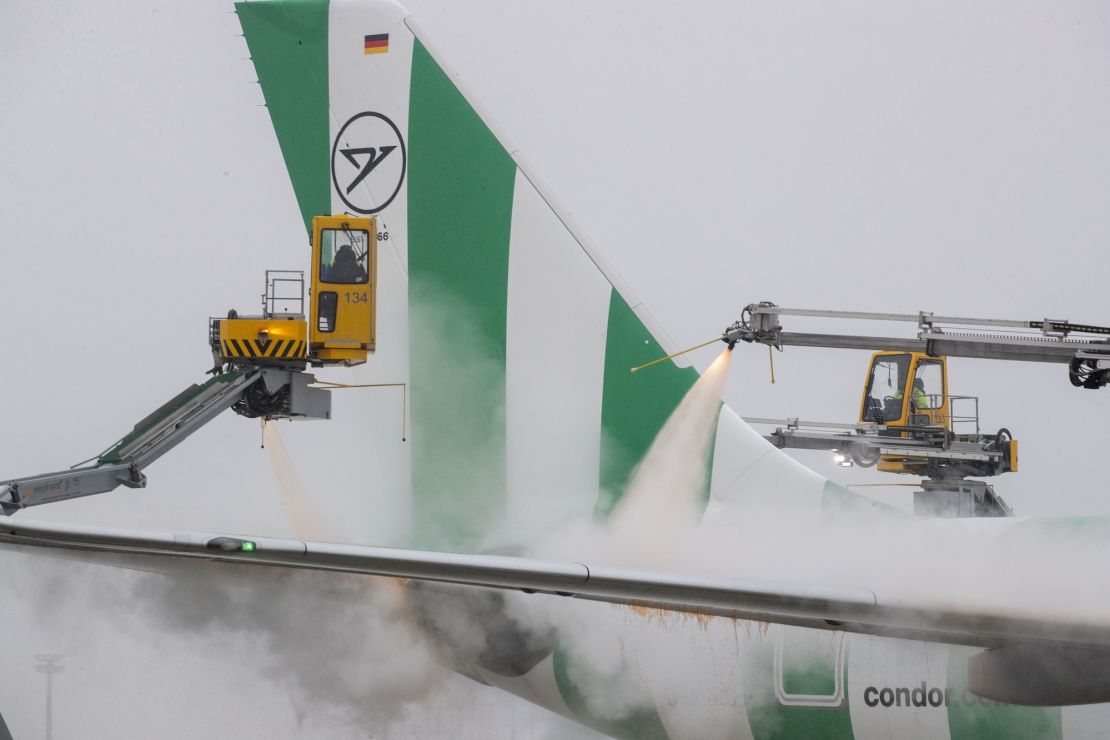 An aircraft is de-iced at Frankfurt Airport on Sunday.