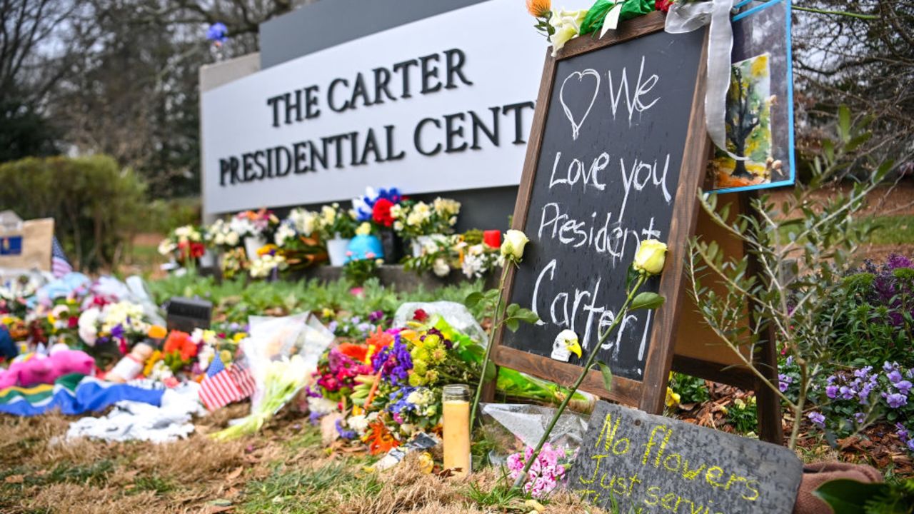 A memorial for former US President Jimmy Carter is seen in front of the Carter Presidential Center in Atlanta, Georgia on January 5, 2025. Carter, the 39th President of the United States, died at the age of 100 on December 29, 2024 at his home in Plains, Georgia. (Photo by Richard PIERRIN / AFP) (Photo by RICHARD PIERRIN/AFP via Getty Images)