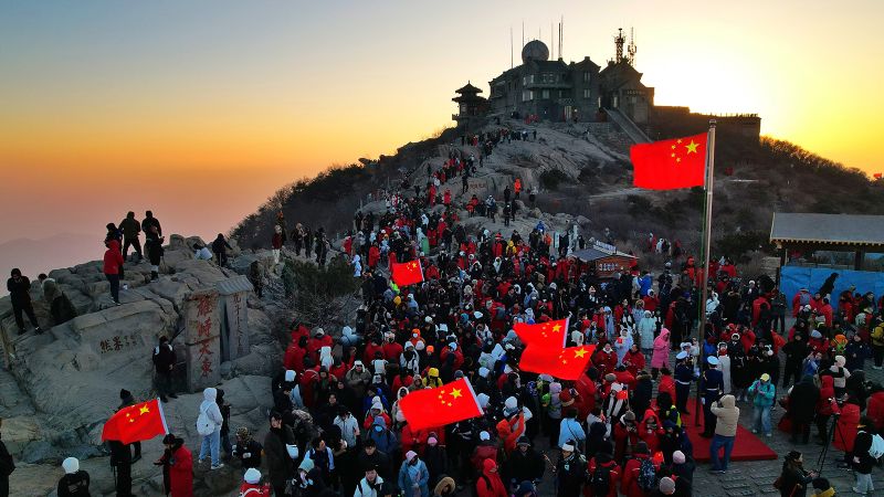 Robotic exoskeletons help Chinese tourists climb the country’s most punishing mountain