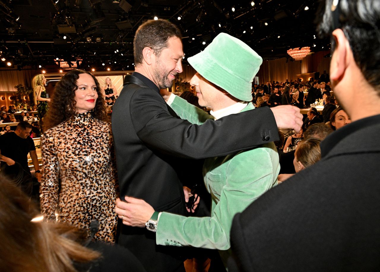 Ebon Moss-Bachrach, center left, greets Jeremy Strong during the ceremony.