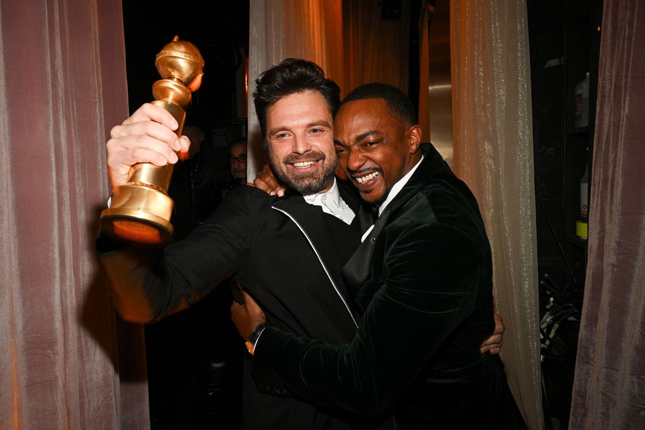 Sebastian Stan and Anthony Mackie backstage after Stan won best male actor in a comedy for "A Different Man."