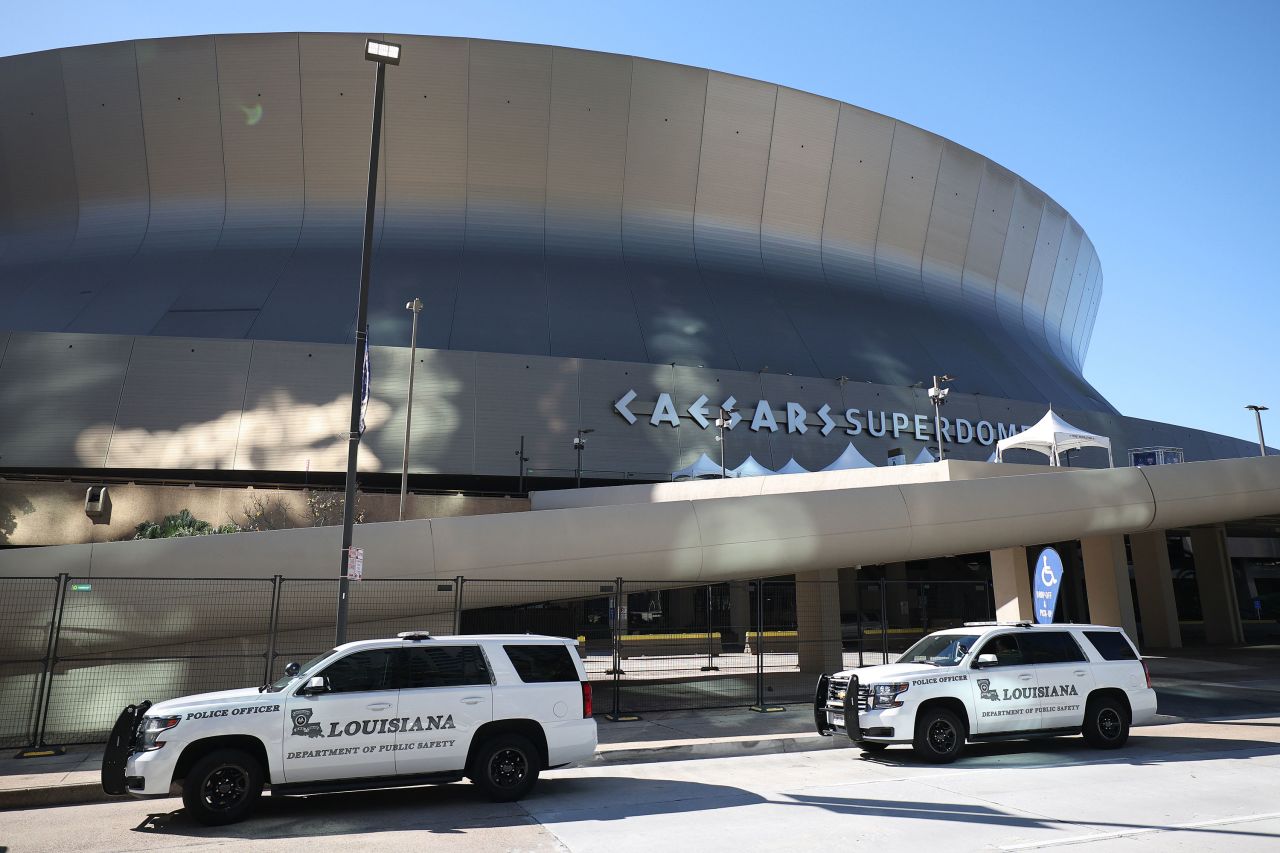 Police vehicles are seen outside Caesars Superdome in New Orleans on January 1.