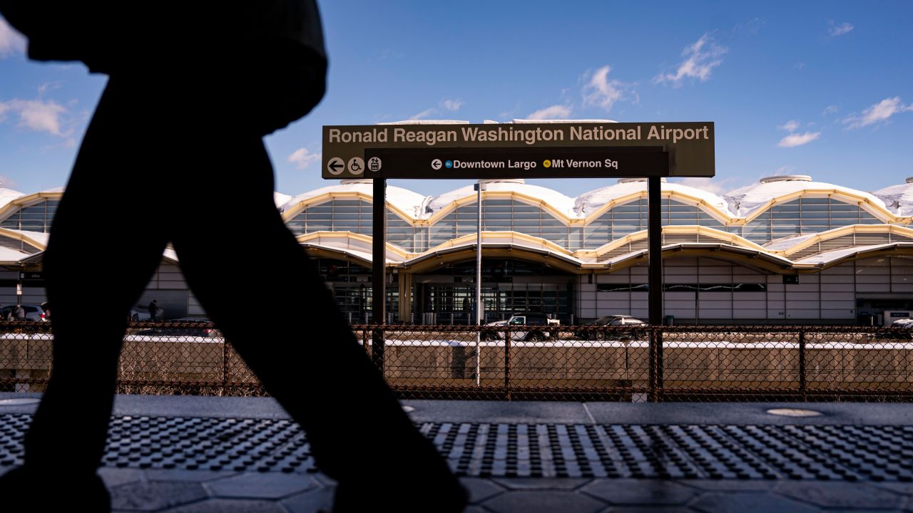 A commuter at the Ronald Reagan National Airport (DCA) Metro stop in Arlington, Virginia, US, on Tuesday, Jan. 7, 2025. A winter storm grounded flights across the eastern and central US on Monday, shutting federal offices in Washington and knocking out power across six states. Photographer: Al Drago/Bloomberg via Getty Images