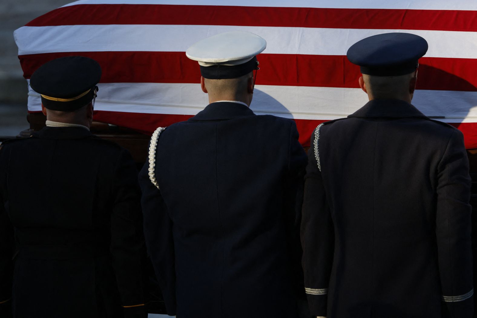 Carter's casket is loaded onto a horse-drawn caisson, which was used in a funeral procession down Pennsylvania and Constitution Avenues on its way to the Capitol.