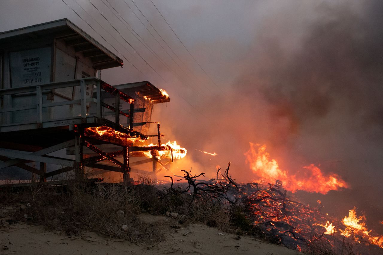 Lifeguard towers go up in flames from the Palisades Fire on Tuesday.