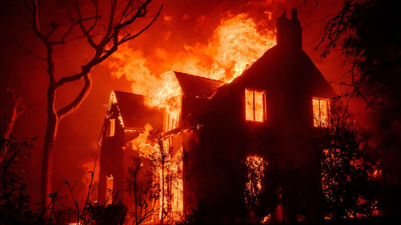 TOPSHOT - A home burns during the Eaton fire in the Altadena area of Los Angeles County, California on January 8, 2025. Terrified residents caught in blazing neighbourhoods, influencers ignoring the ban on drones and the frightening unpredictability of the wildfires are just some of what journalists covering the fires ravaging Los Angeles for AFP have had to manage.
The United States' second-largest city has never faced a blaze of this scale, driven by an extreme autumn drought and fierce Santa Ana winds -- the strongest since 2011 -- that have turned dry hills into kindling, fuelling a relentless inferno that has raged for more than a week. (Photo by JOSH EDELSON / AFP) (Photo by JOSH EDELSON/AFP via Getty Images)          
