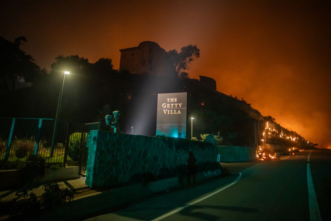 Flames from the Palisades Fire reach the grounds of the Getty Villa museum along the Pacific Coast Highway on January 8.