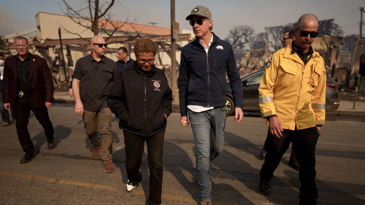 California Governor Gavin Newsom and Los Angeles Mayor Karen Bass tour the downtown business district of Pacific Palisades as the Palisades Fire continues to burn on January 8, 2025 in Los Angeles, California. Fueled by intense Santa Ana Winds, the Palisades Fire has grown to over 2,900 acres and 30,000 people have been ordered to evacuate while a second major fire continues to burn near Eaton Canyon in Altadena.