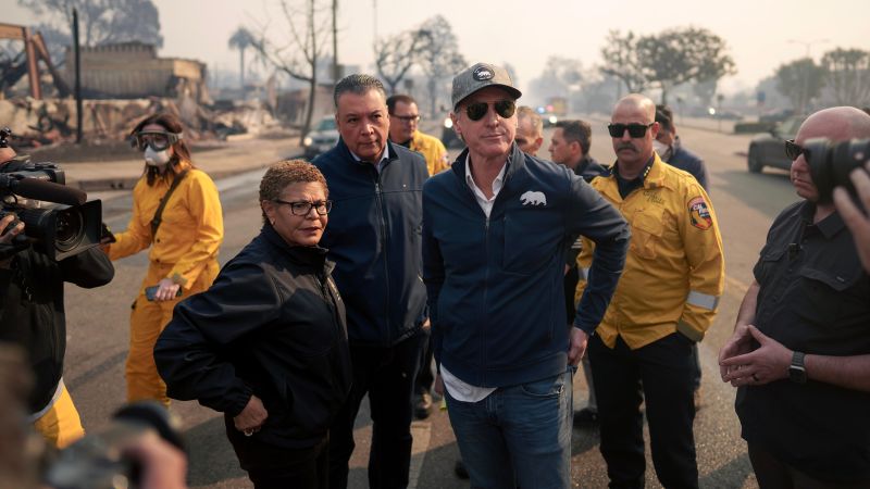 As the L.A. fires rage, Mayor Karen Bass faces fierce criticism for overseas trip, budget cuts