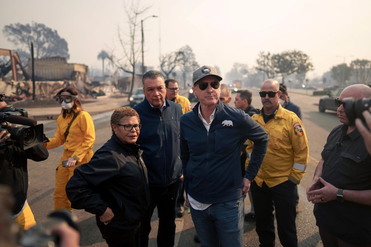 California Gov. Gavin Newsom and Los Angeles Mayor Karen Bass tour the downtown business district of Pacific Palisades on Wednesday as the Palisades Fire burns in Los Angeles.