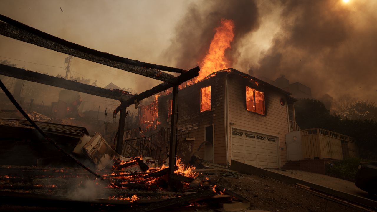 LOS ANGELES, CALIFORNIA - JANUARY 8: Flames from the Palisades Fire burn a home on January 8, 2025 in the Pacific Palisades neighborhood of Los Angeles, California. Fueled by intense Santa Ana Winds, the Palisades Fire has grown to over 2,900 acres and 30,000 people have been ordered to evacuate while a second major fire continues to burn near Eaton Canyon in Altadena. (Photo by Eric Thayer/Getty Images)