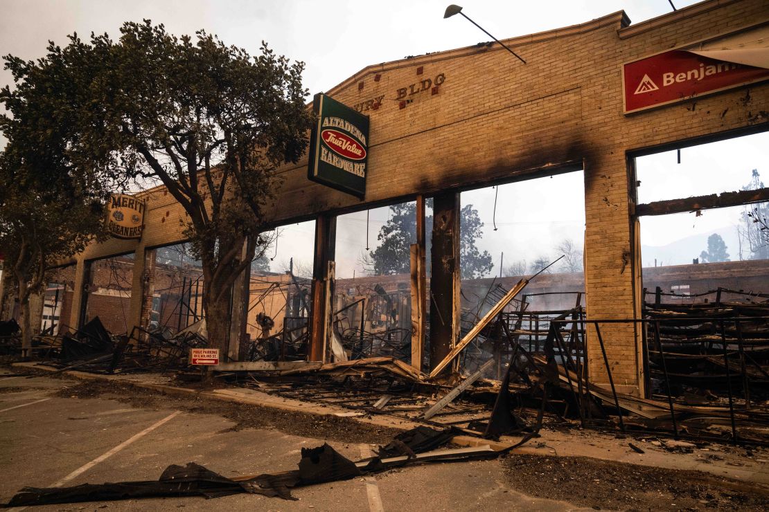 The brick frame of Altadena Hardware remains on Wednesday after the Eaton Fire burned through the center of town.