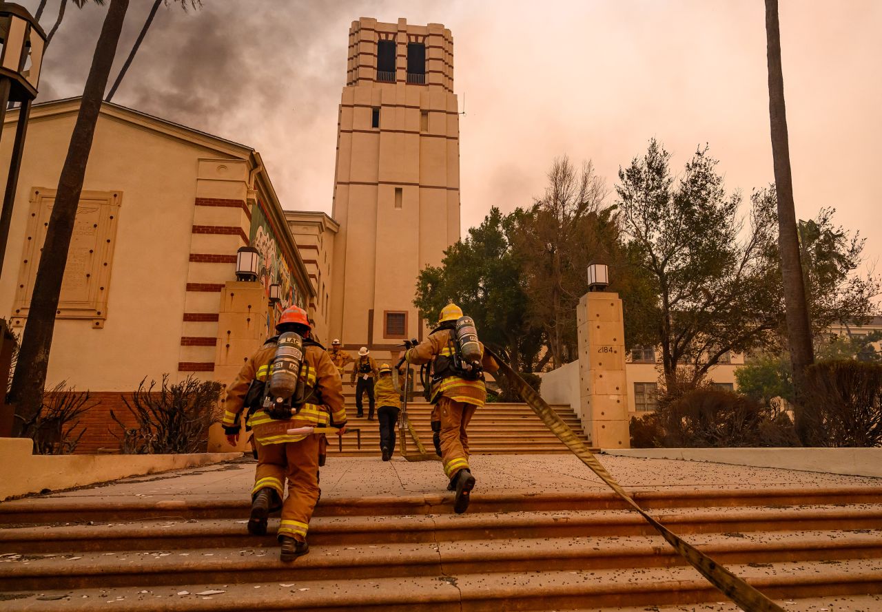 Firefighters prepare to fight flames at Eliot Arts Magnet Middle School in Altadena, California on January 8.