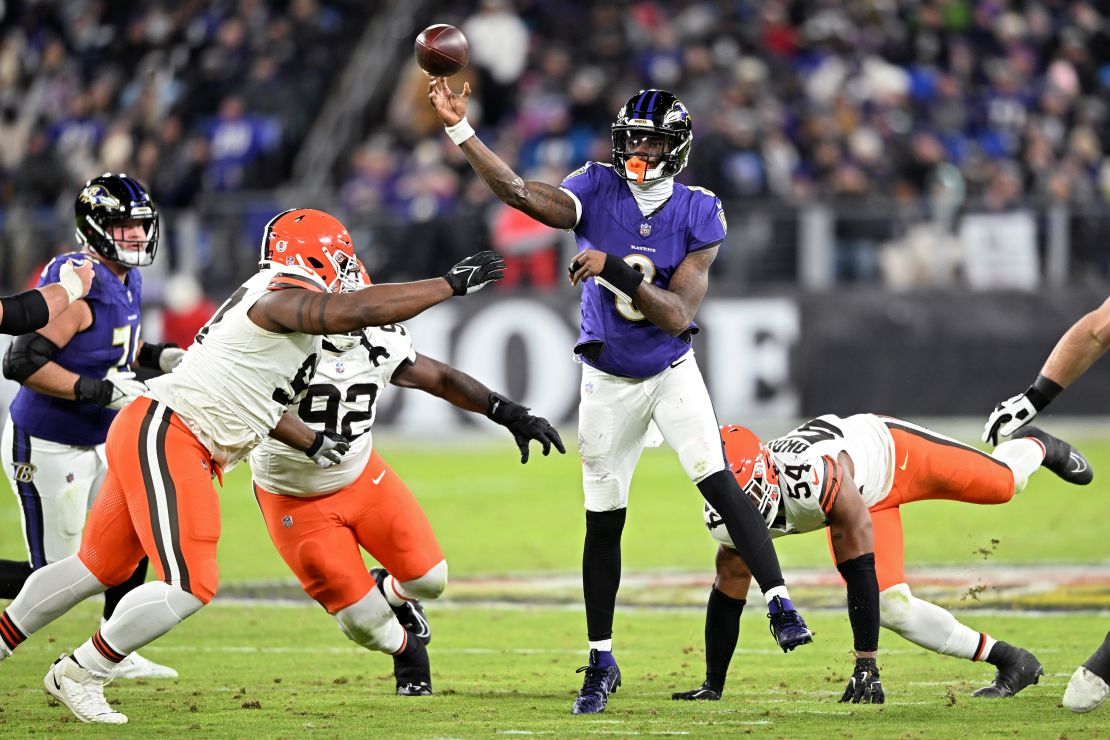 Lamar Jackson #8 of the Baltimore Ravens throws a pass in front of Ogbo Okoronkwo of the Cleveland Browns in the second quarter at M&T Bank Stadium.